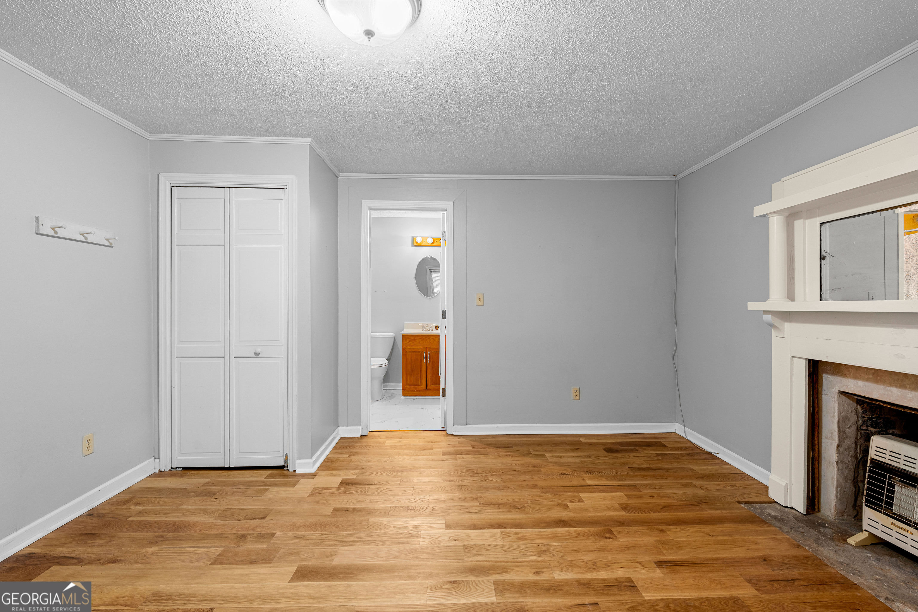 1330 Dunn Road Molena, GA 30258 - Photo 36 of 56 a view of empty room with wooden floor and fireplace