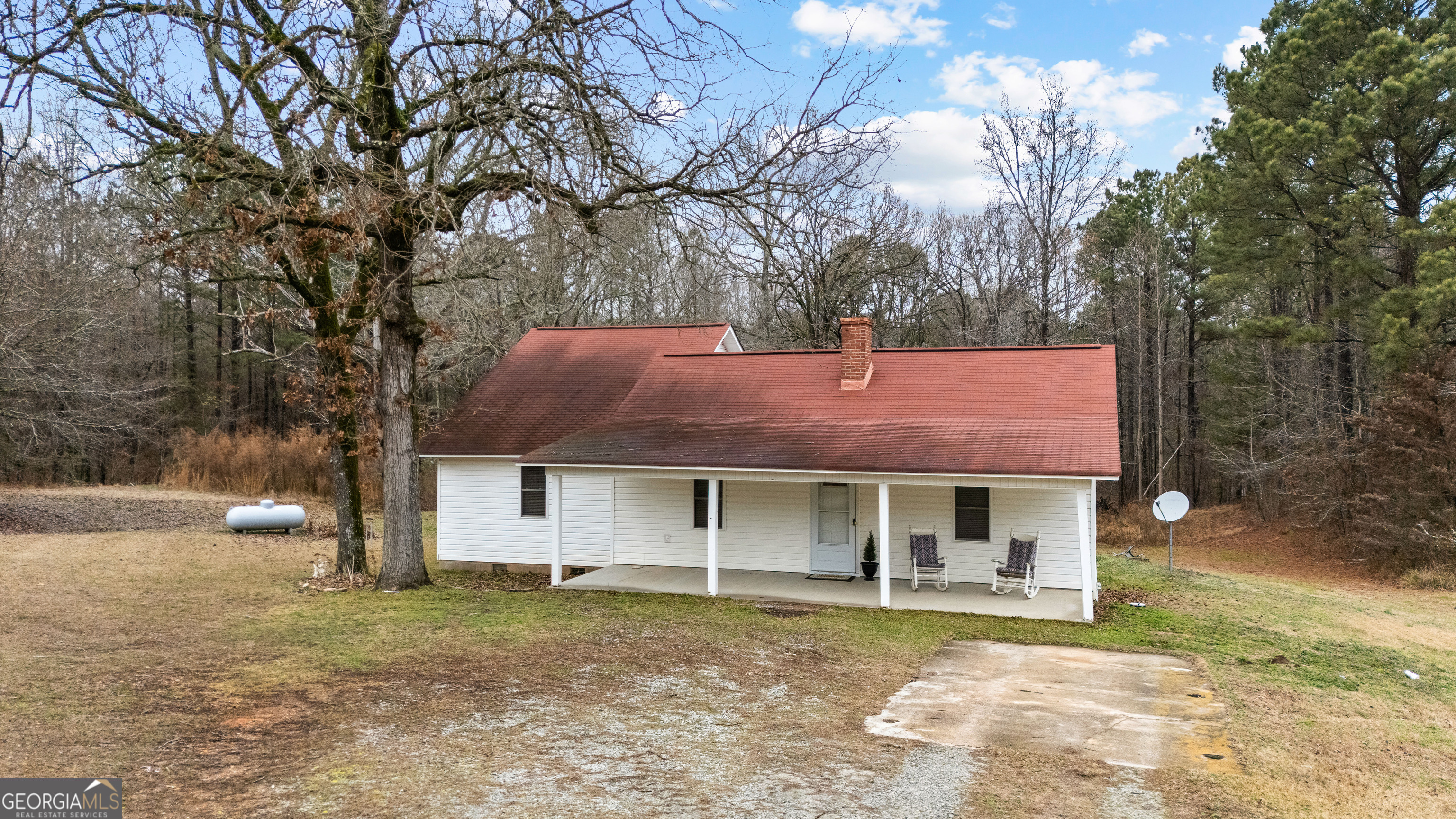 1330 Dunn Road Molena, GA 30258 - Photo 53 of 56 a front view of a house with a garden and tree