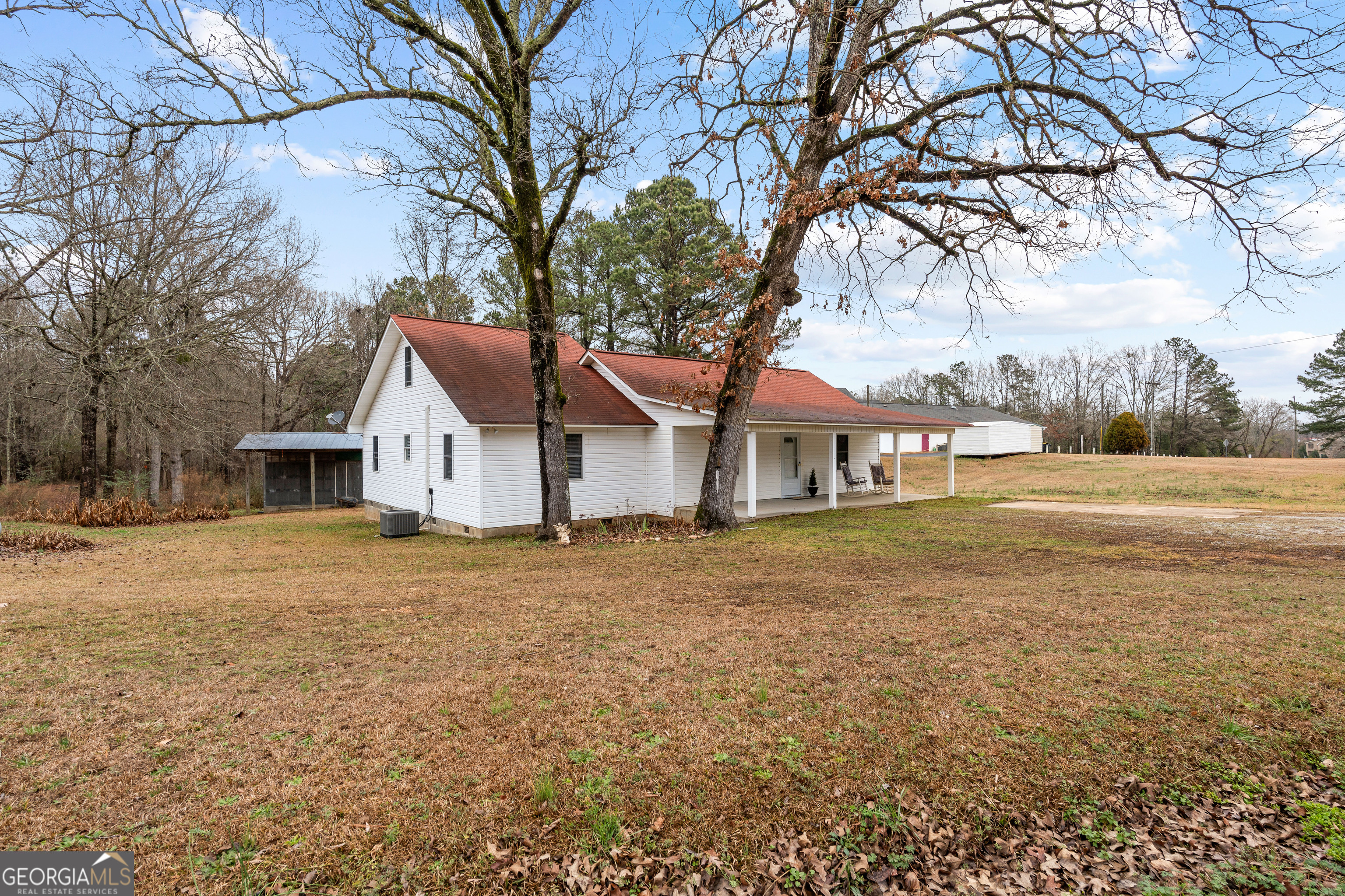 1330 Dunn Road Molena, GA 30258 - Photo 8 of 56 a front view of a house with a yard and garage