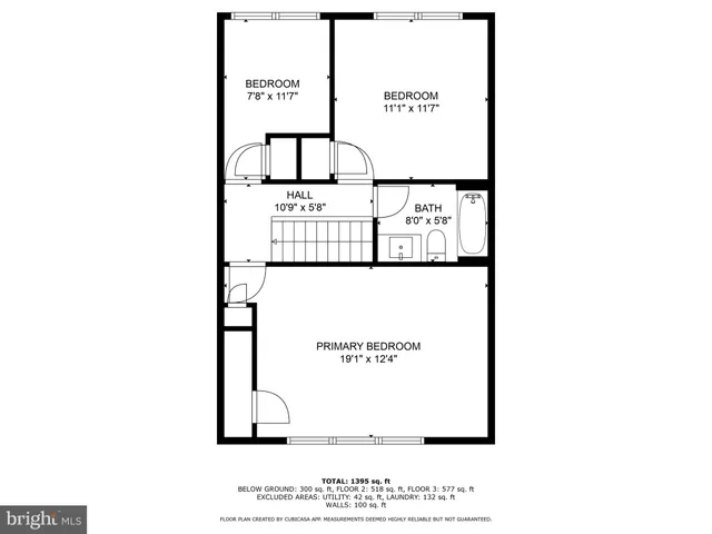 a picture of a bench in front of a wall