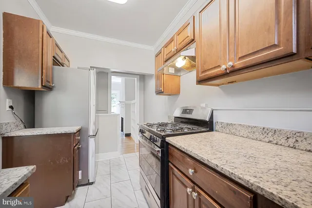 a kitchen with a stove and a microwave