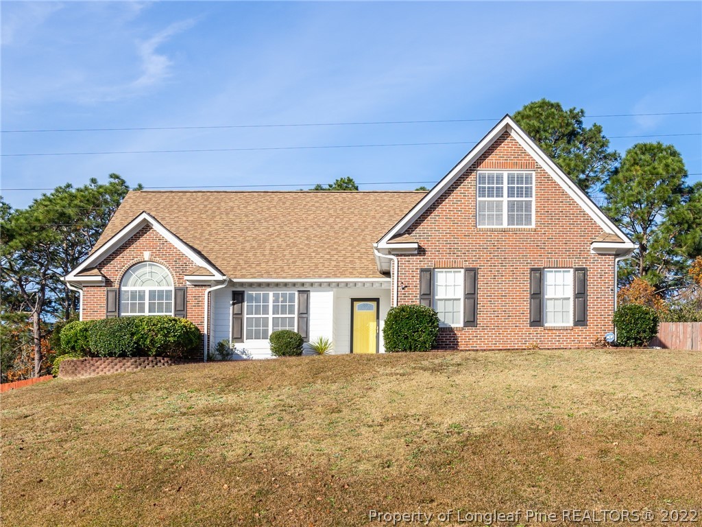 5716 Spreading Branch Road Hope Mills, NC 28348 - Photo 1 of 37 a front view of a house with a yard