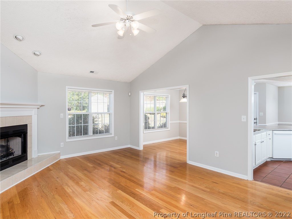 5716 Spreading Branch Road Hope Mills, NC 28348 - Photo 14 of 37 a view of empty room with wooden floor and fan