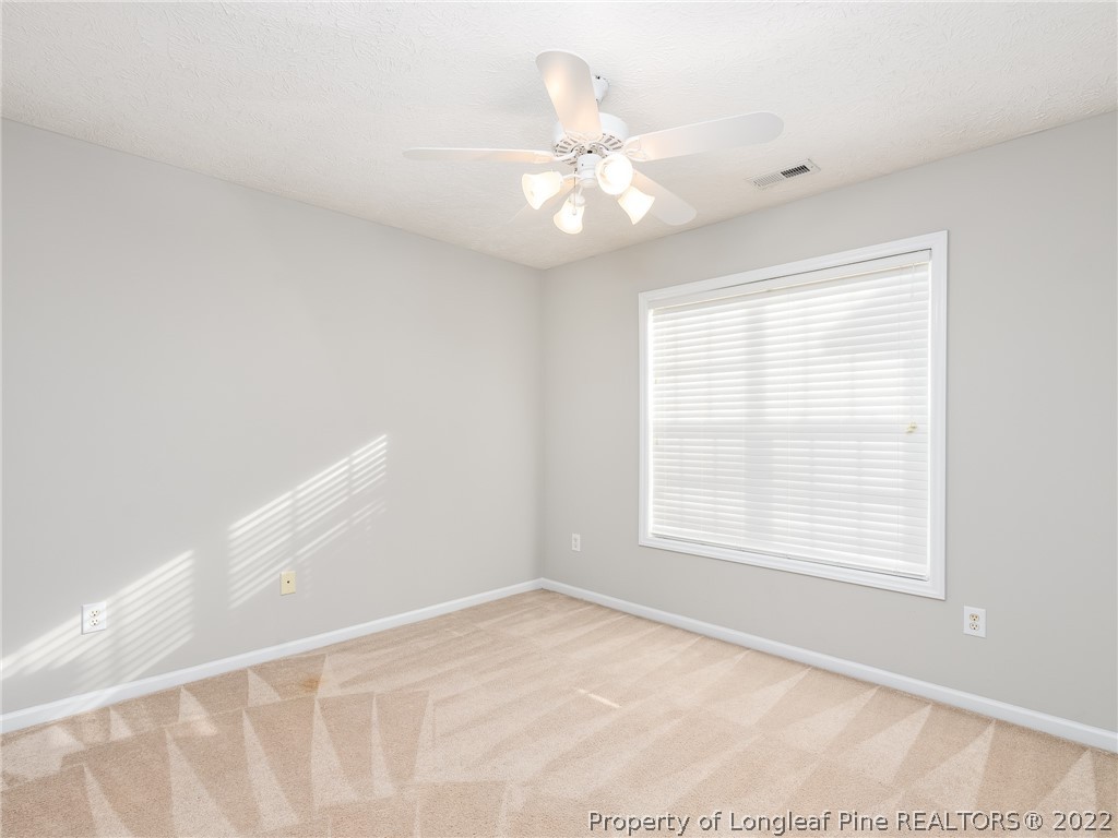 5716 Spreading Branch Road Hope Mills, NC 28348 - Photo 28 of 37 a view of an empty room with a window