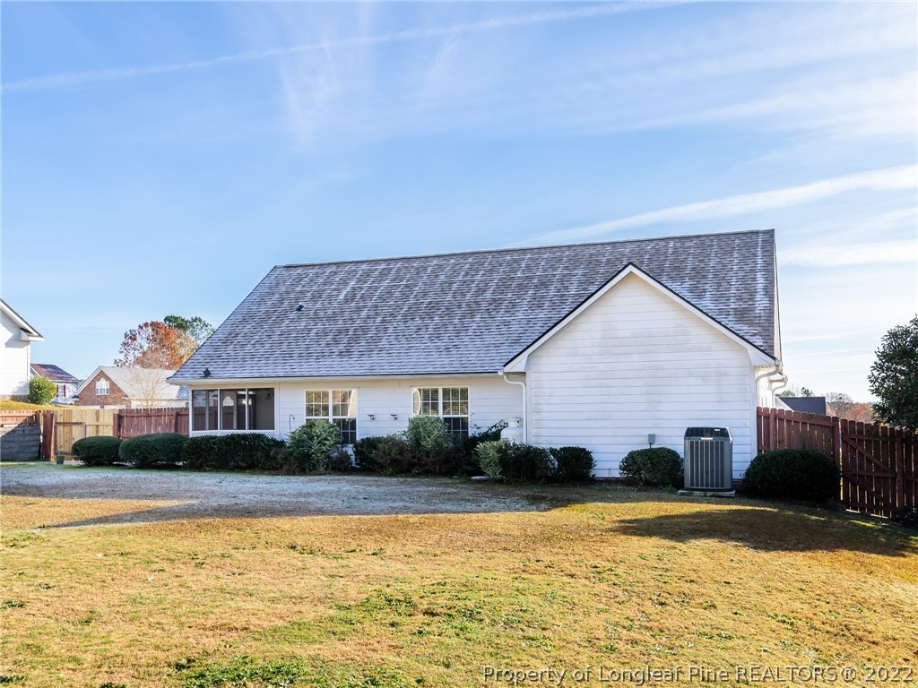 5716 Spreading Branch Road Hope Mills, NC 28348 - Photo 6 of 37 a view of a house with a swimming pool with a patio