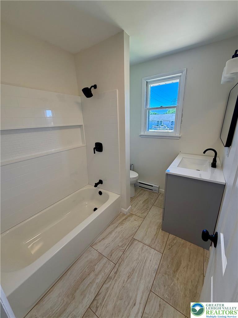 3508 Nazareth Road Easton, PA 18045 - Photo 23 of 25 A well-lit full bathroom features sleek tile flooring and contemporary fixtures.