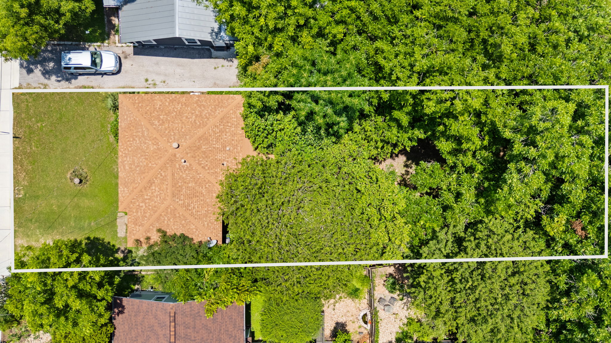 3704 Cherrywood Road Austin, TX 78722 - Photo 38 of 40 An aerial perspective of the home with the tree filled lot.
