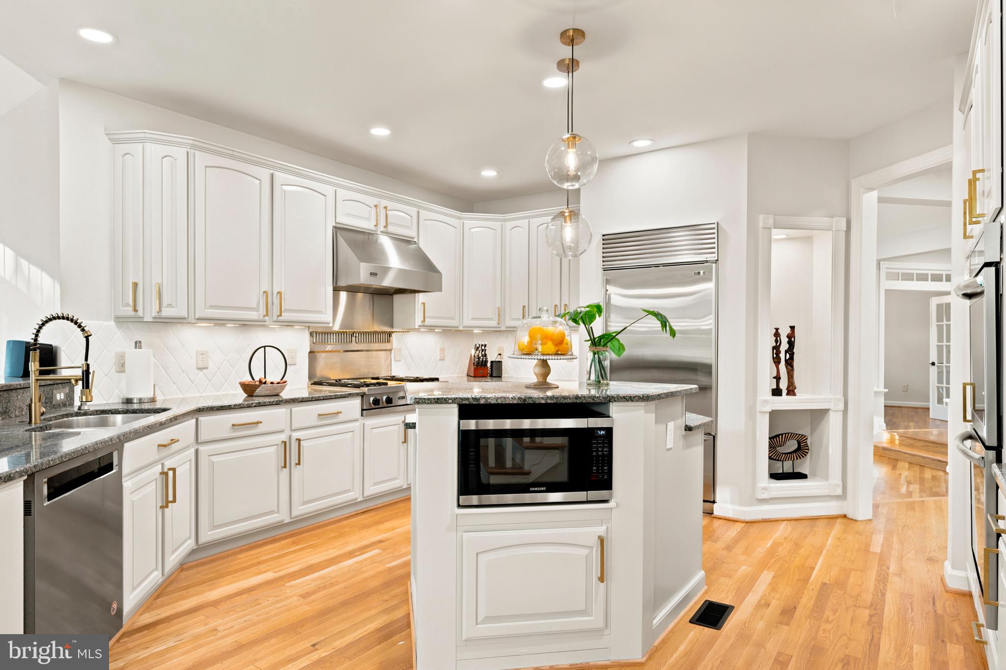 9313 Harrisons Farm Way Laytonsville, MD 20882 - Photo 6 of 77 a kitchen with stainless steel appliances a stove a sink and a refrigerator