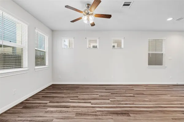 a view of wooden floor in a hallway