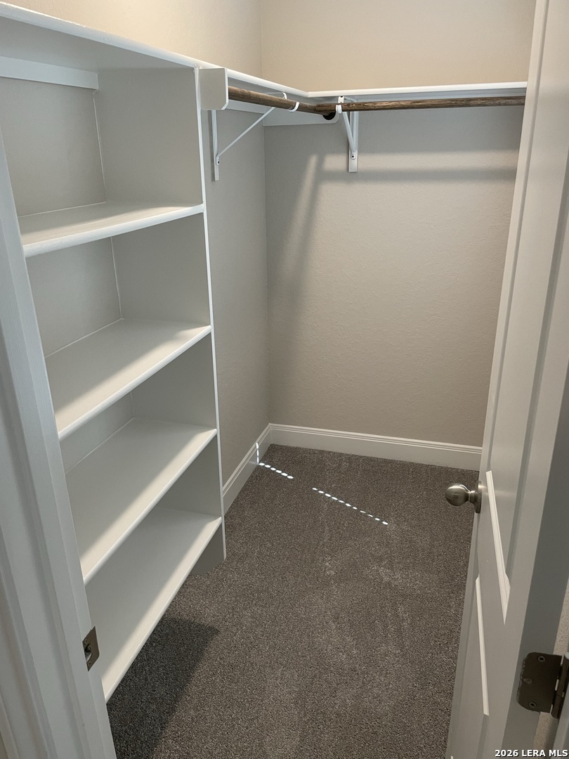 13109 Reid Meadows Live Oak, TX 78233 - Photo 9 of 15 a view of walk in closet with empty racks