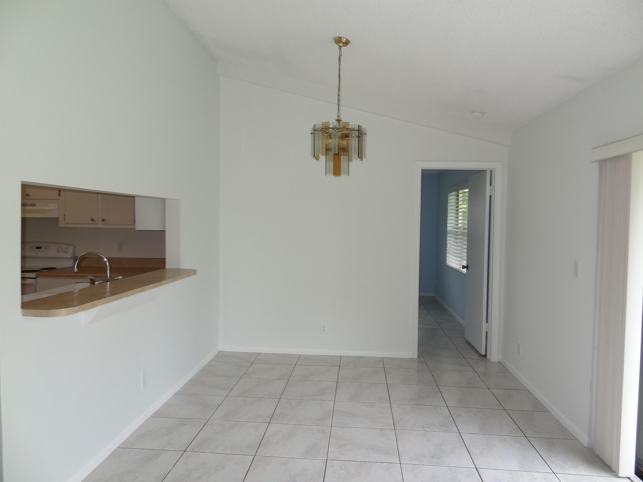 9781 Alaska Circle Boca Raton, FL 33434 - Photo 7 of 39 DINING ROOM W/PASS THROUGH FROM KITCHEN