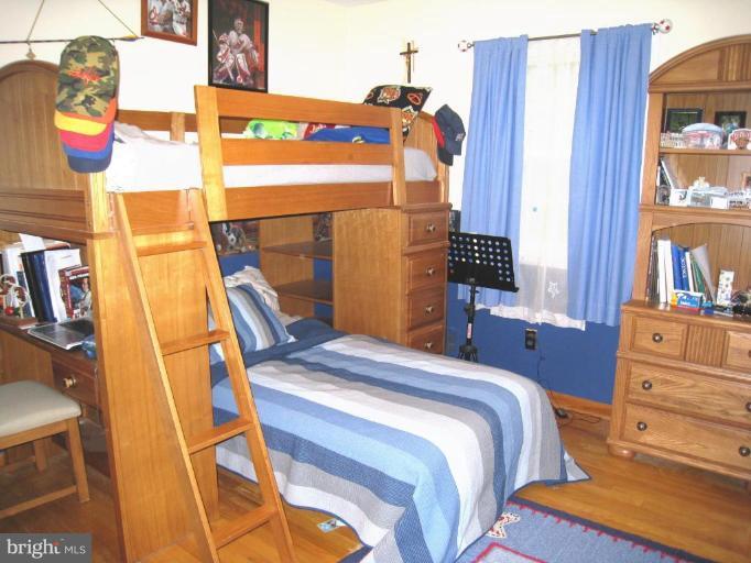 757 Hawthorne Road Linthicum Heights, MD 21090 - Photo 14 of 23 a bedroom with a bed and a closet