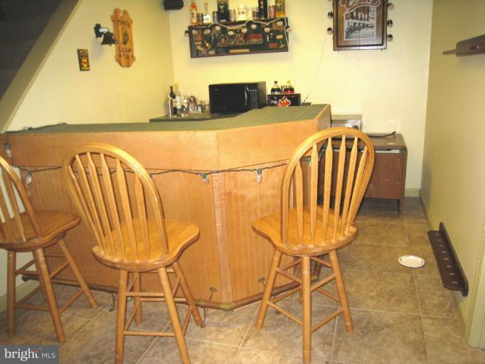 757 Hawthorne Road Linthicum Heights, MD 21090 - Photo 17 of 23 a dining room with table and chairs