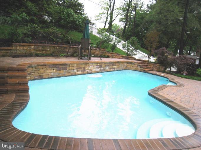 757 Hawthorne Road Linthicum Heights, MD 21090 - Photo 20 of 23 a view of a swimming pool with a yard