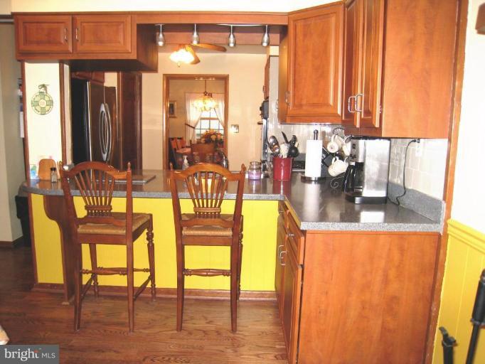 757 Hawthorne Road Linthicum Heights, MD 21090 - Photo 3 of 23 a view of a dining room with furniture and wooden floor