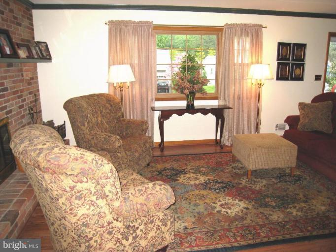 757 Hawthorne Road Linthicum Heights, MD 21090 - Photo 6 of 23 a living room with furniture and a large window