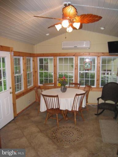 757 Hawthorne Road Linthicum Heights, MD 21090 - Photo 9 of 23 a view of a dining room with furniture wooden floor and chandelier