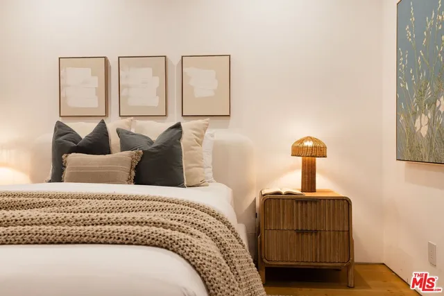 a bedroom with furniture and a window