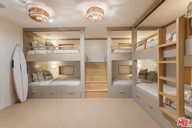 a bathroom with a bathtub and a walk in closet