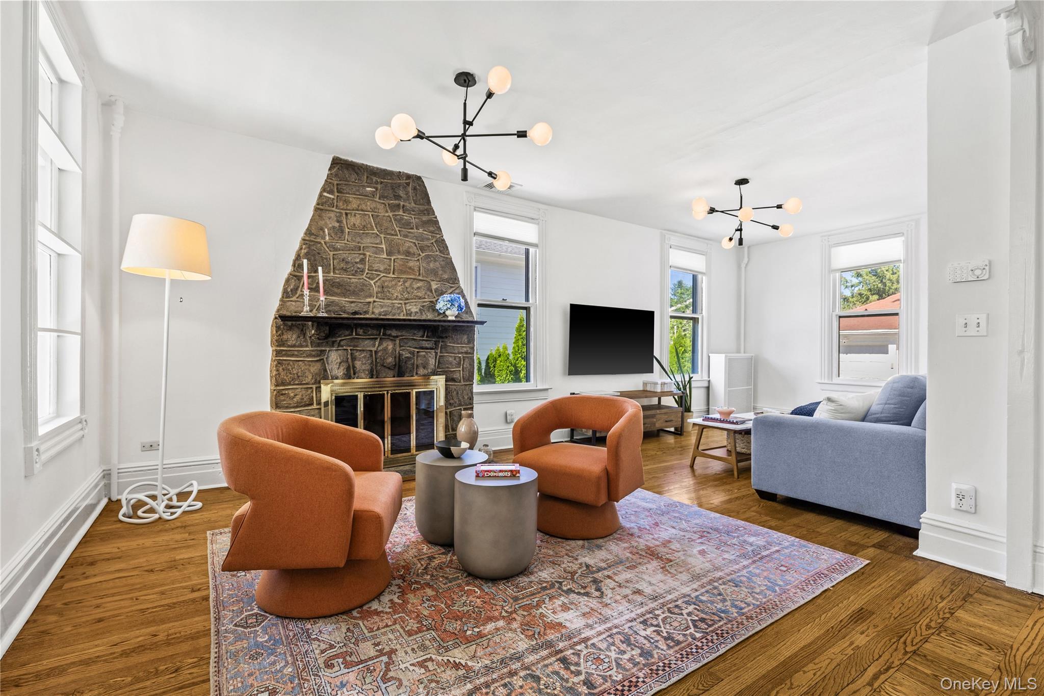 113 Brambach Road Scarsdale, NY 10583 - Photo 5 of 38 Airy and light LR w/ 9 ft ceilings and a striking stone fireplace