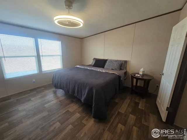 a view of a house with backyard sitting area and garden