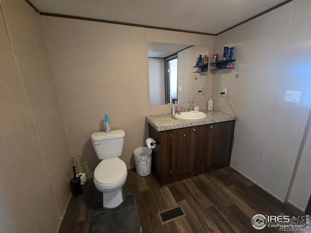 a bedroom with a bed and a cabinets