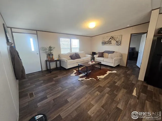 a kitchen with sink refrigerator and window