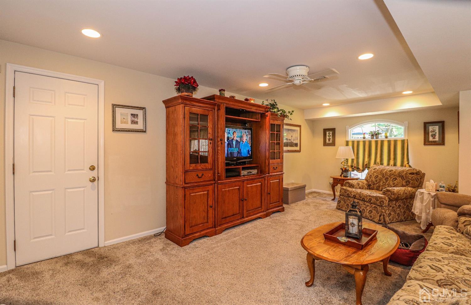 32 Monaghan Road Edison, NJ 08817 - Photo 11 of 35 a living room with furniture and a wooden floor