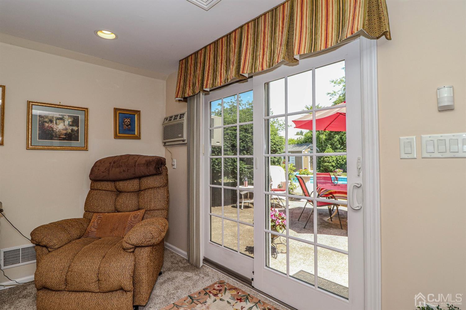 32 Monaghan Road Edison, NJ 08817 - Photo 12 of 35 a living room with furniture and a floor to ceiling window