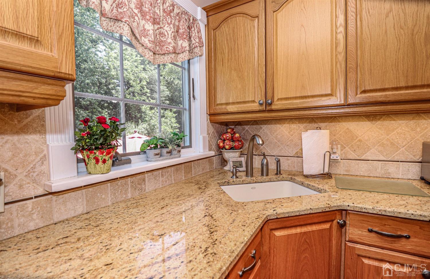 32 Monaghan Road Edison, NJ 08817 - Photo 15 of 35 a kitchen with granite countertop a sink and a window