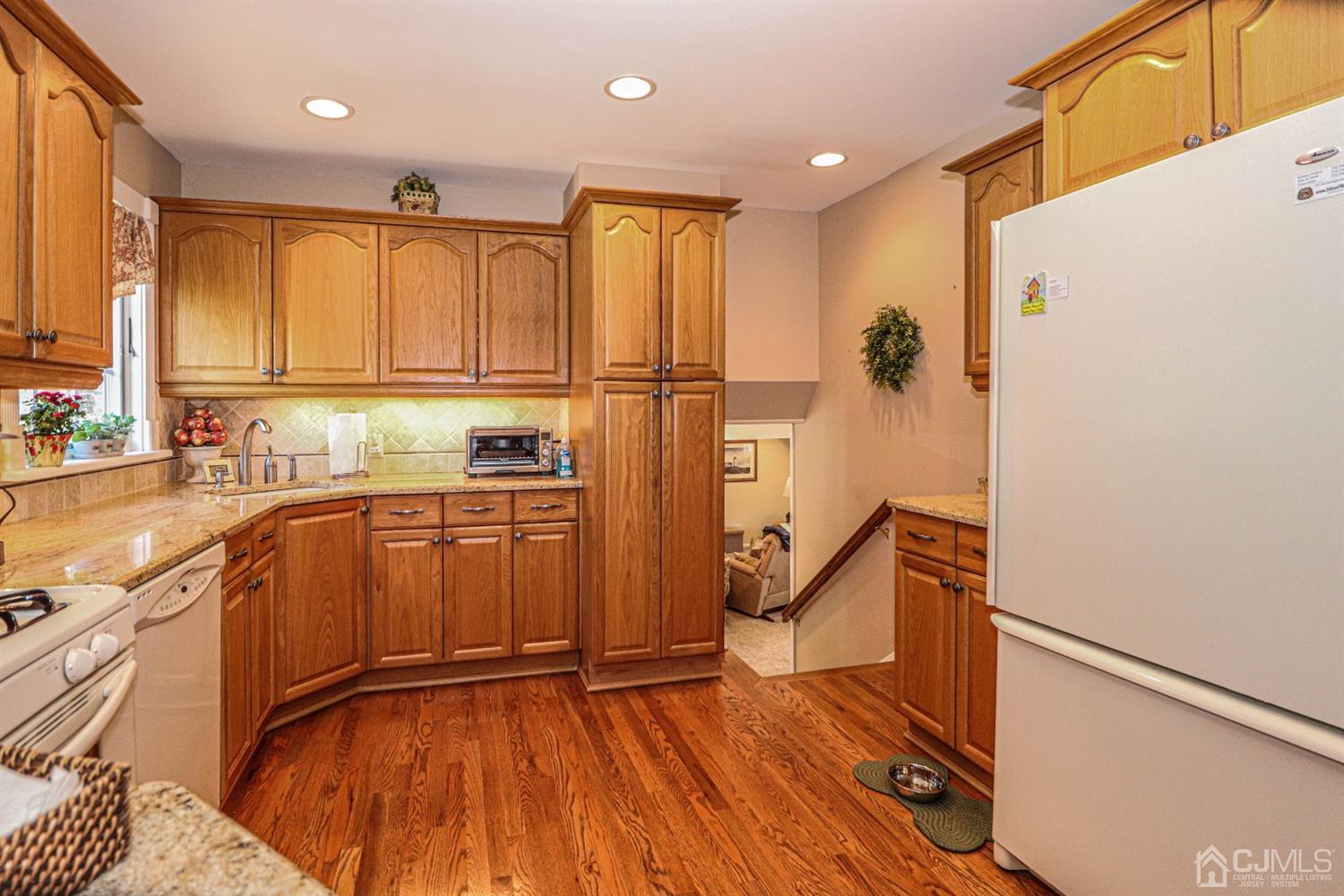 32 Monaghan Road Edison, NJ 08817 - Photo 16 of 35 a kitchen with granite countertop a refrigerator sink and cabinets