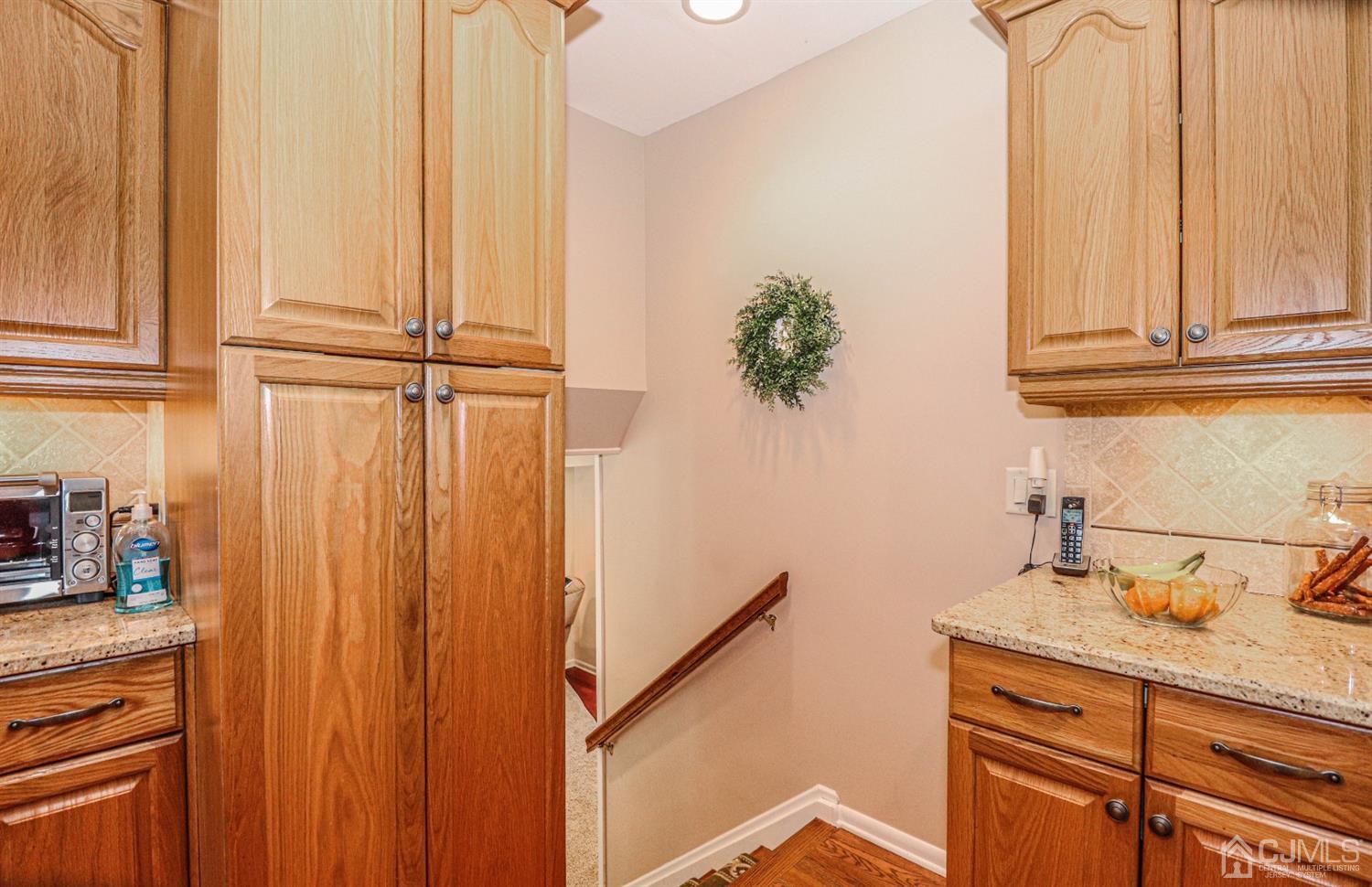 32 Monaghan Road Edison, NJ 08817 - Photo 17 of 35 a bathroom with a granite countertop sink and a mirror