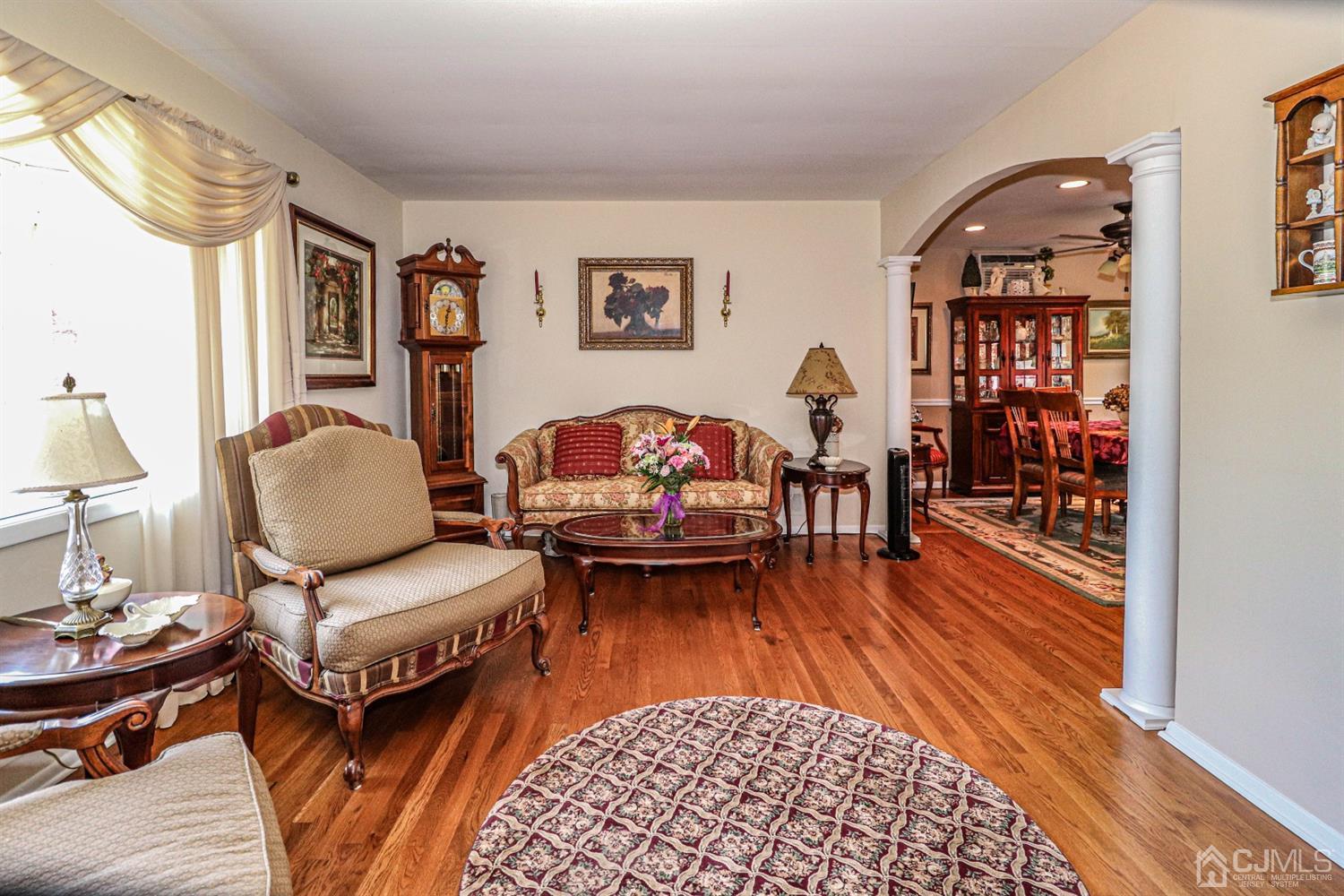 32 Monaghan Road Edison, NJ 08817 - Photo 19 of 35 a living room with furniture and wooden floor
