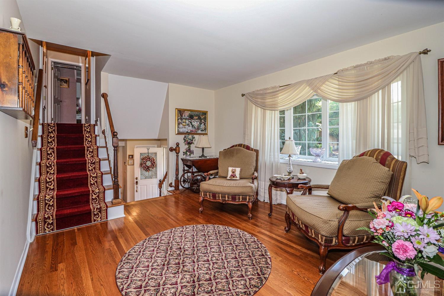 32 Monaghan Road Edison, NJ 08817 - Photo 20 of 35 a living room with furniture fireplace and a large window