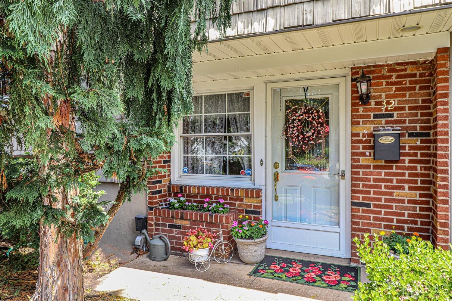 32 Monaghan Road Edison, NJ 08817 - Photo 3 of 35 a balcony with table and chairs and potted plants