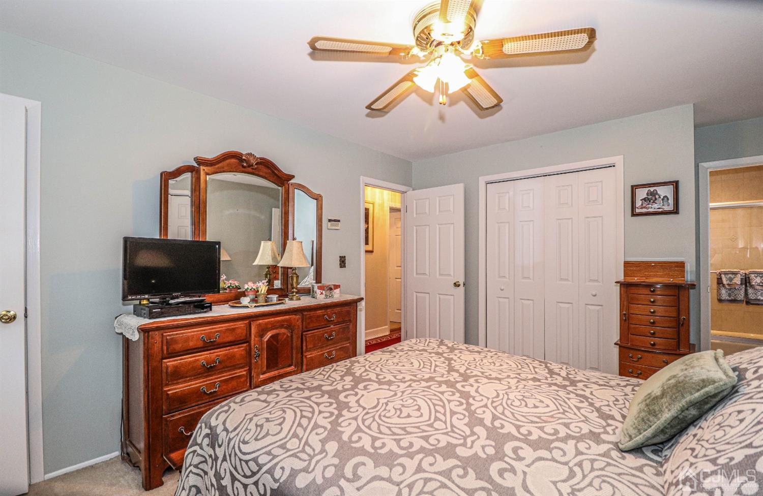32 Monaghan Road Edison, NJ 08817 - Photo 24 of 35 a bedroom with a bed and a flat screen tv