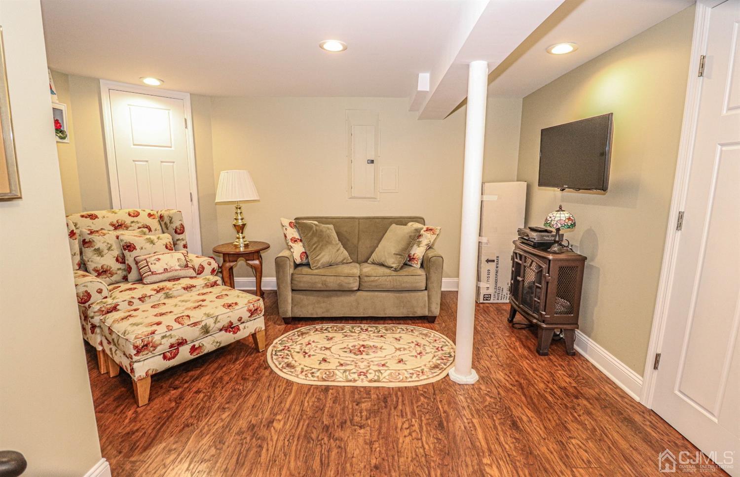 32 Monaghan Road Edison, NJ 08817 - Photo 28 of 35 a living room with furniture and a flat screen tv