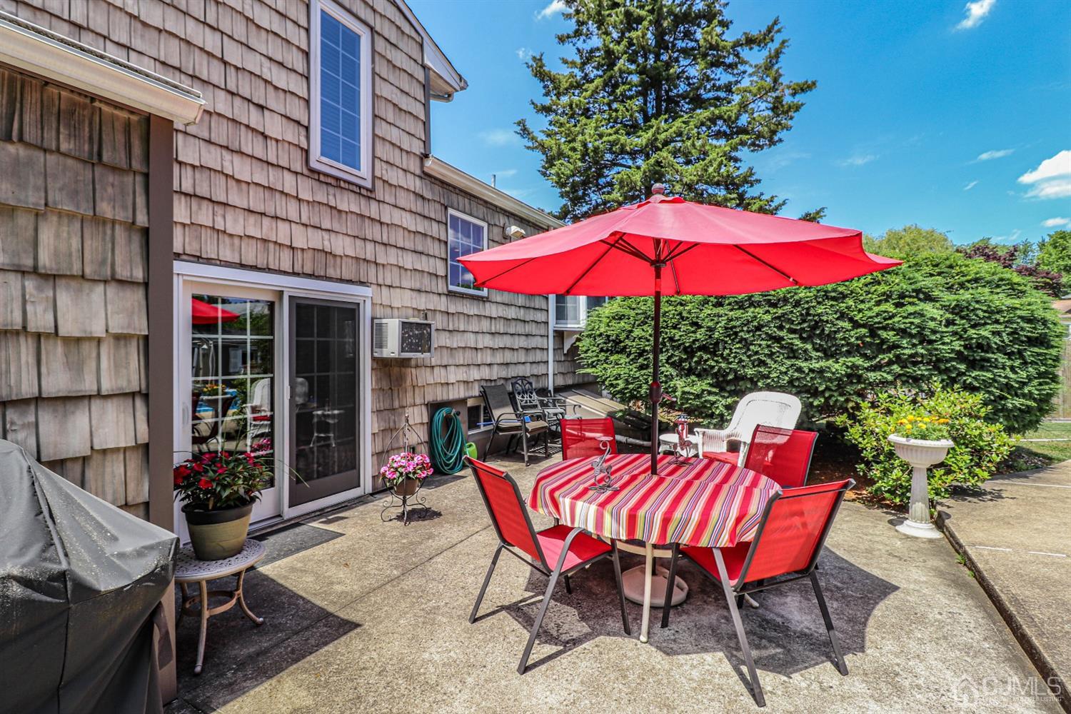32 Monaghan Road Edison, NJ 08817 - Photo 30 of 35 a view of backyard with seating space and wooden roof