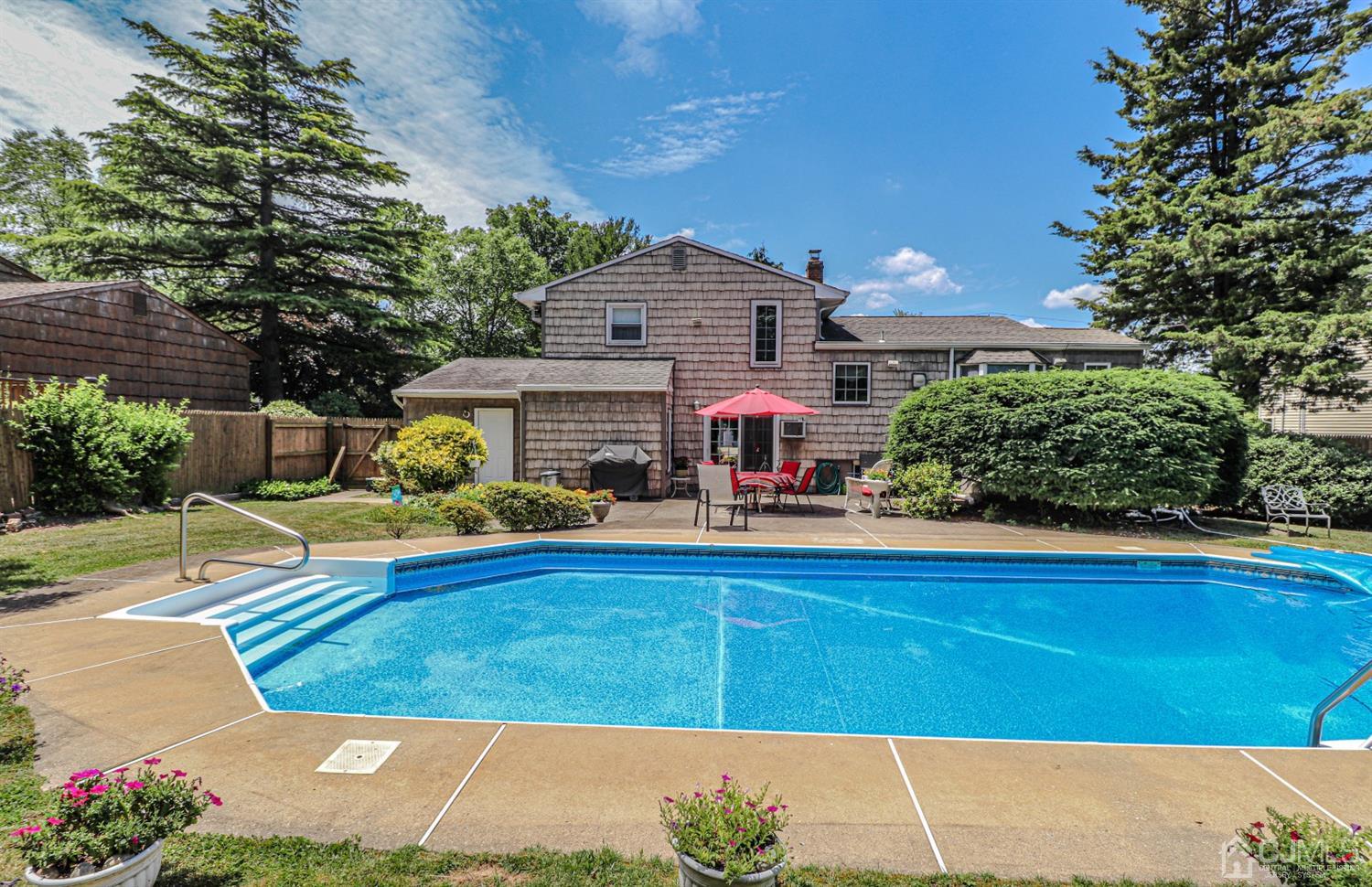 32 Monaghan Road Edison, NJ 08817 - Photo 34 of 35 a view of a house with a backyard