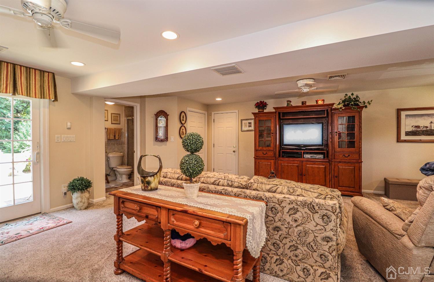32 Monaghan Road Edison, NJ 08817 - Photo 9 of 35 a living room with furniture and a flat screen tv