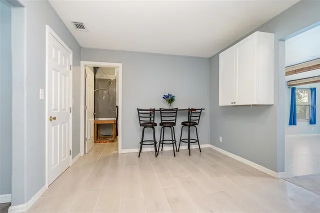 a view of a room that has a table and chair in it