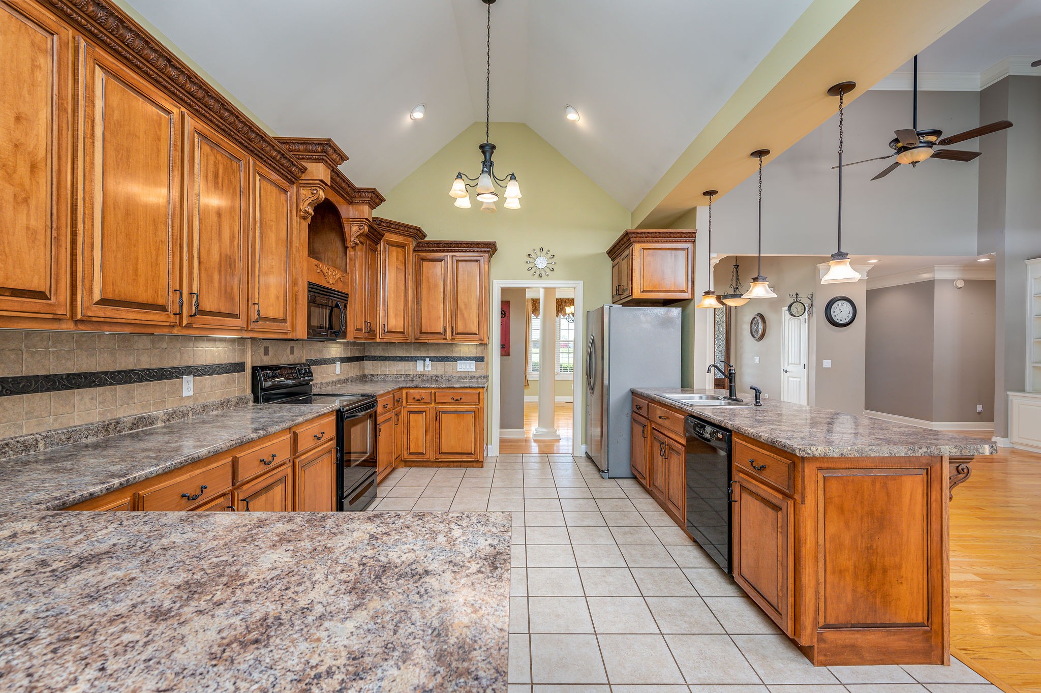 225 Butler Bridge Road Portland, TN 37148 - Photo 8 of 50 a large kitchen with stainless steel appliances granite countertop a large stove a sink dishwasher and oven with cabinets
