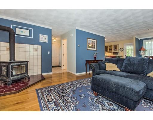 82 Elm Ridge Road Stow, MA 01775 - Photo 4 of 14 a living room with furniture and a fireplace