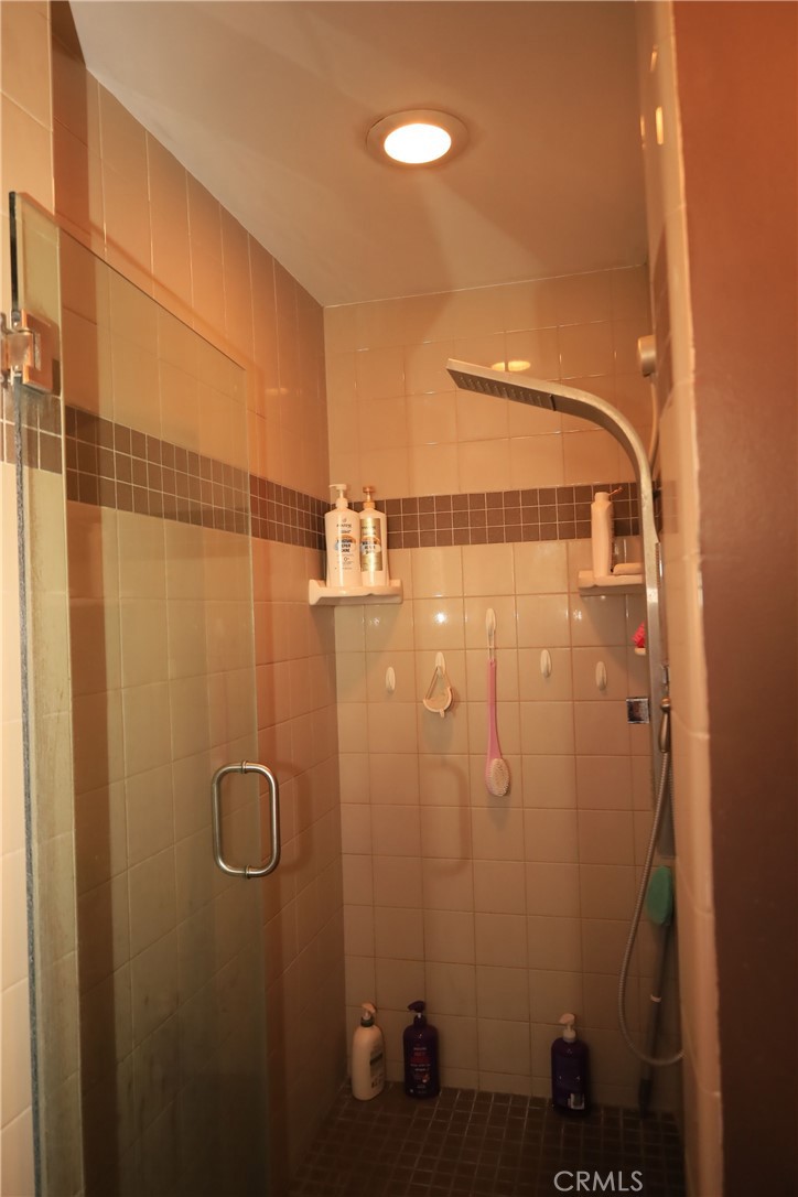 4389 Beverly Court Riverside, CA 92506 - Photo 9 of 14 a bathroom with a shower