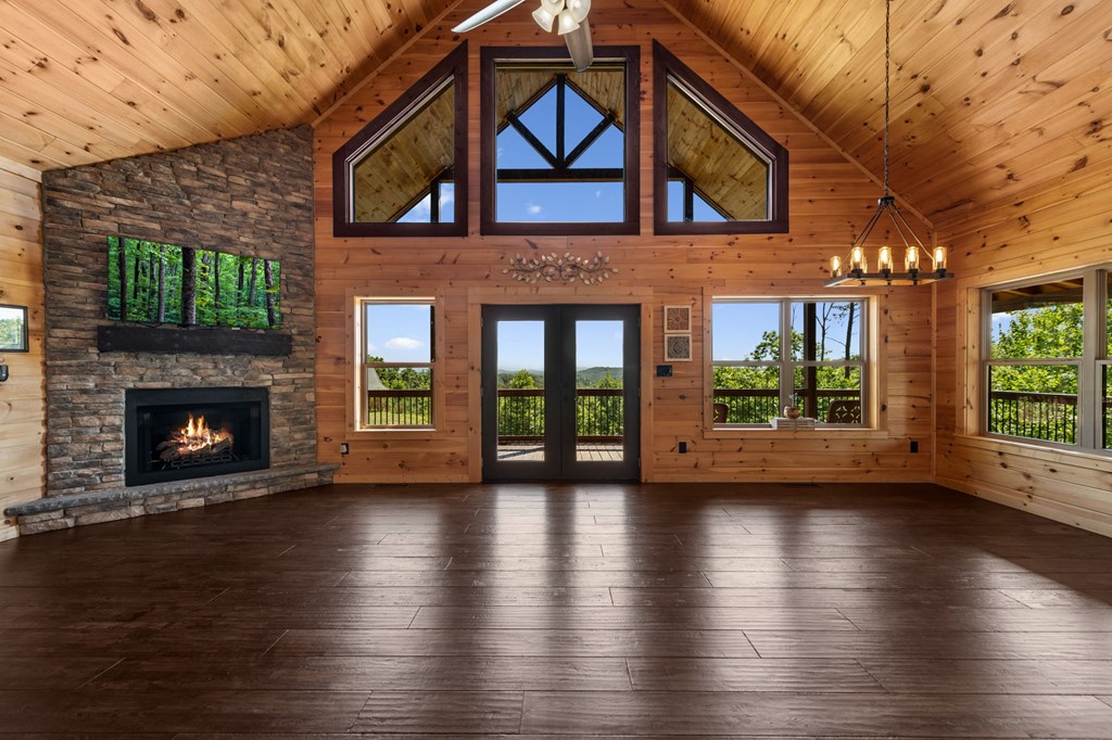 Floor-to-ceiling windows frame the spectacular mountain views