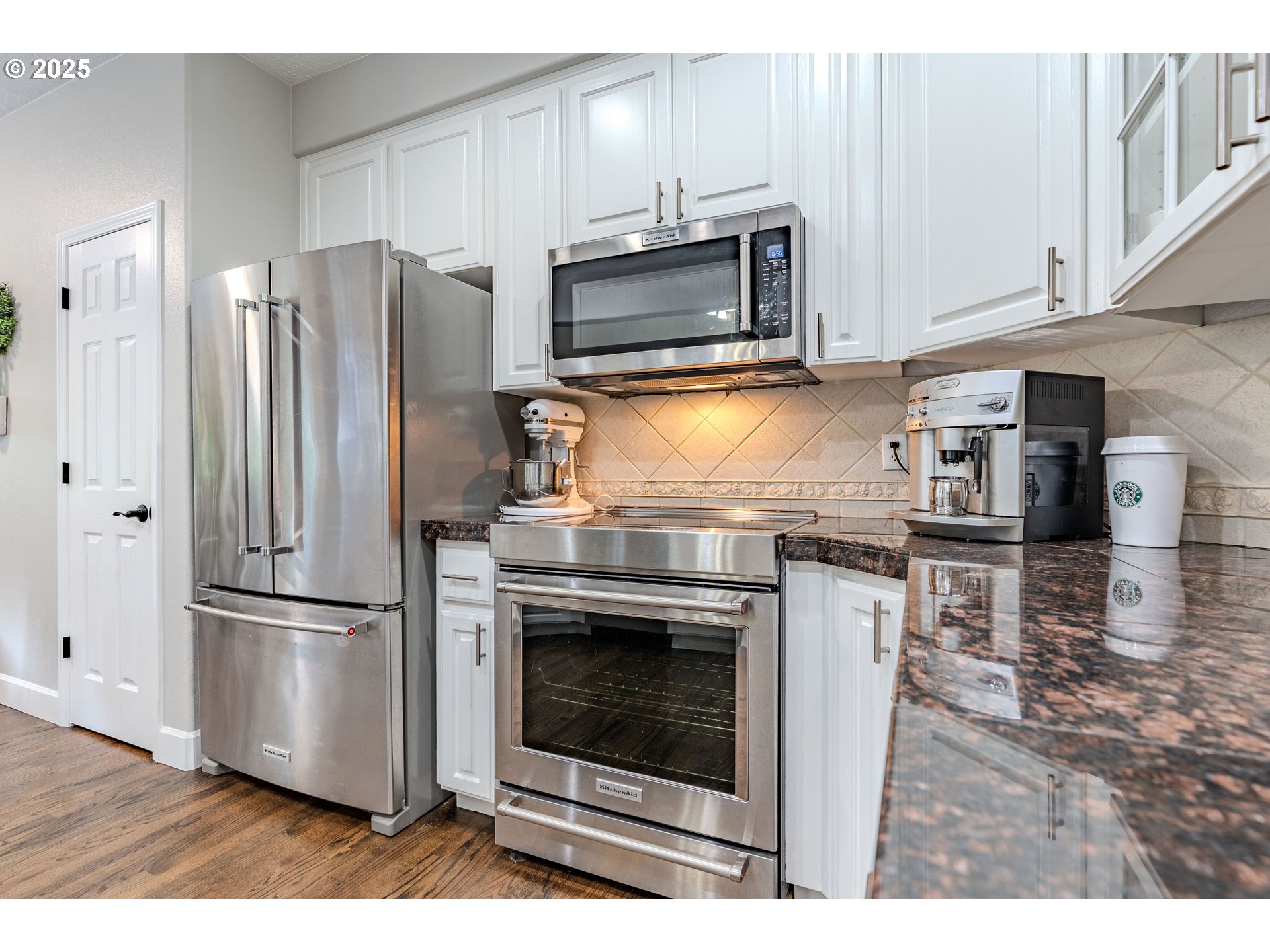 32153 Southeast Bluff Road Gresham, OR 97080 - Photo 12 of 48 a kitchen with granite countertop a refrigerator stove and microwave