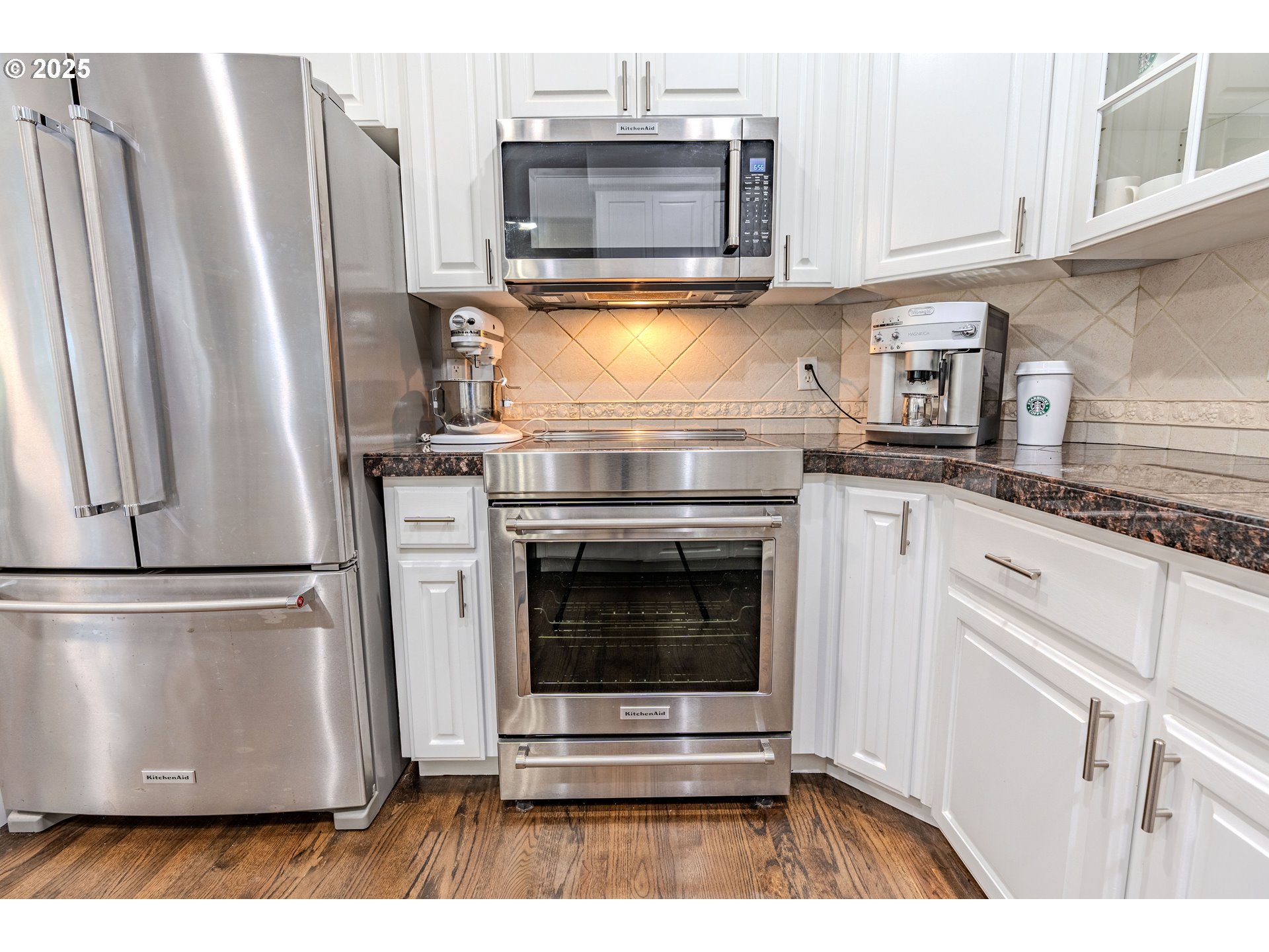 32153 Southeast Bluff Road Gresham, OR 97080 - Photo 14 of 48 a kitchen with granite countertop a refrigerator stove and microwave