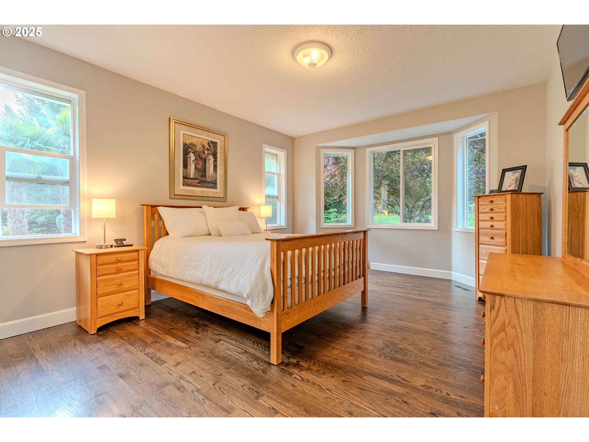32153 Southeast Bluff Road Gresham, OR 97080 - Photo 19 of 48 a bedroom with a bed and wooden floor