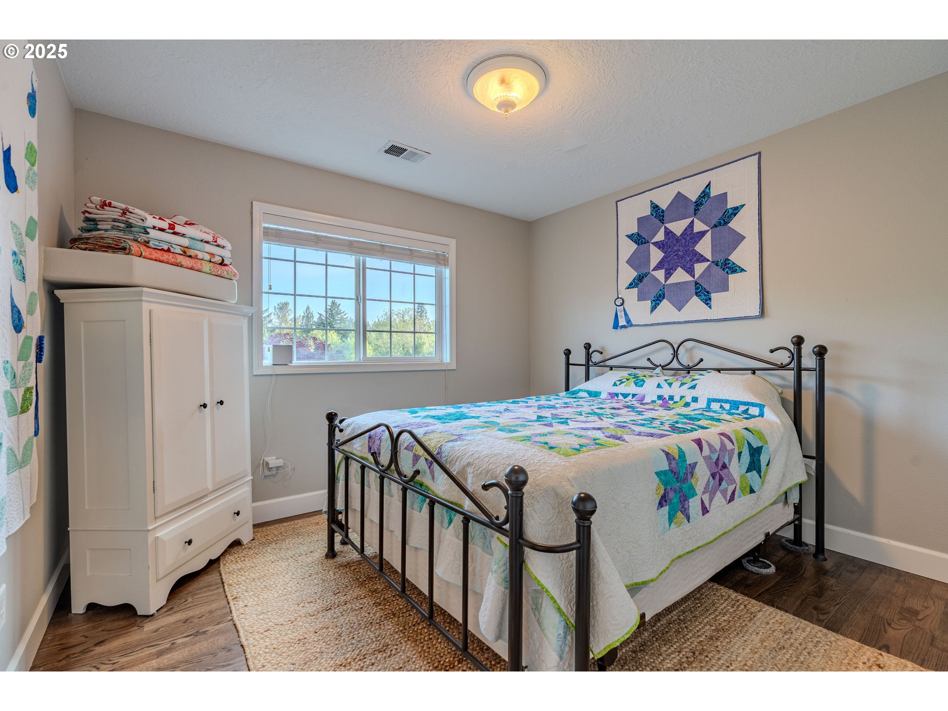 32153 Southeast Bluff Road Gresham, OR 97080 - Photo 28 of 48 a bedroom that has a bed and a table in it