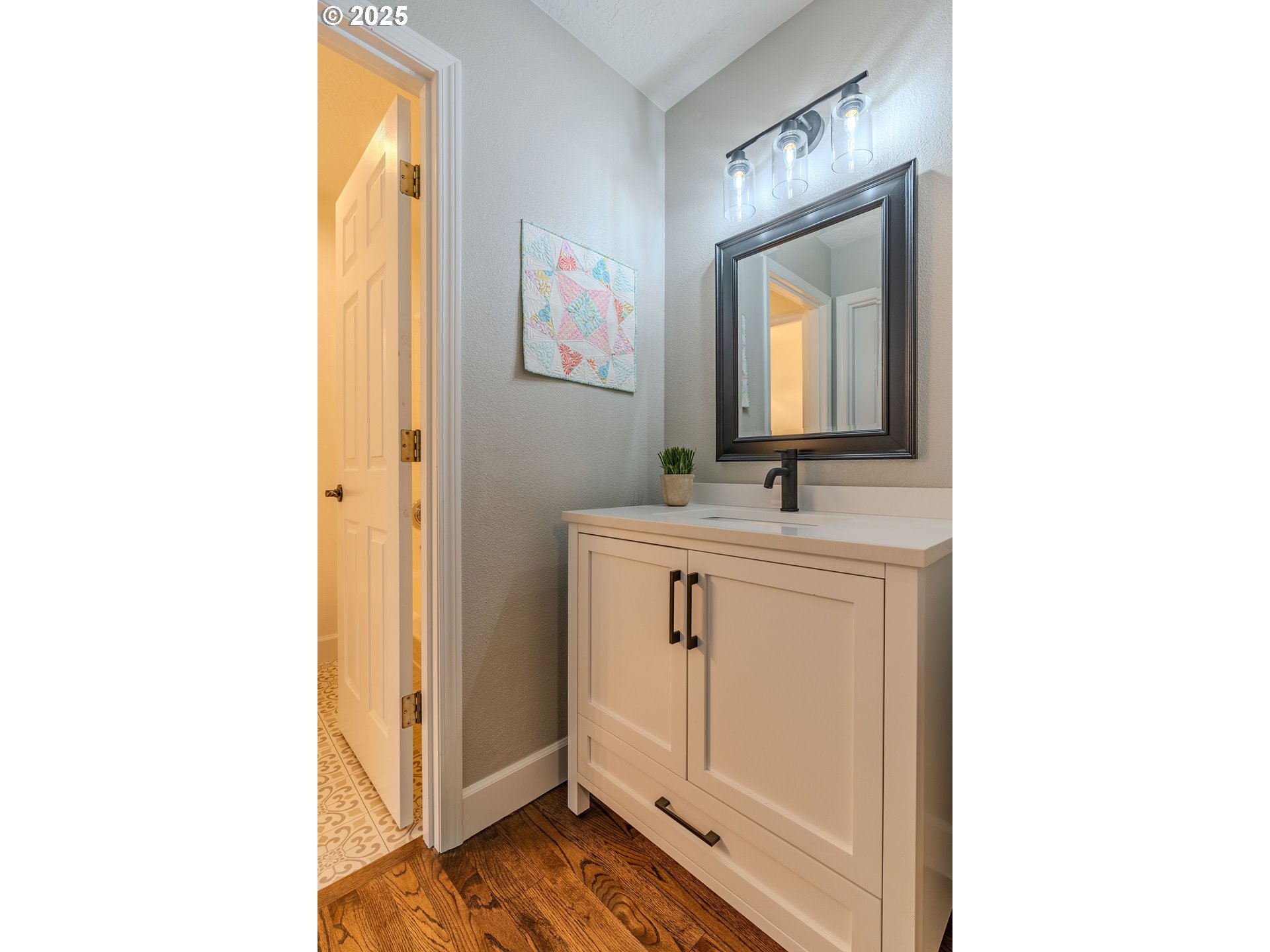 32153 Southeast Bluff Road Gresham, OR 97080 - Photo 32 of 48 a bathroom with a sink a mirror and a vanity